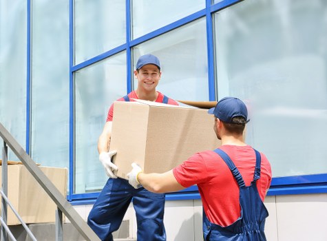 Packed moving boxes and furniture prepared for local house removals
