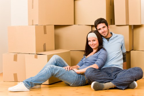 Movers loading household items carefully for transport
