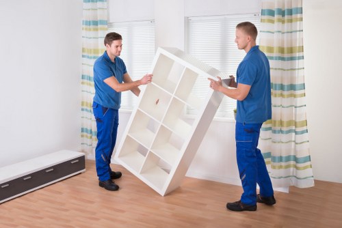 Local moving crew loading furniture into a van