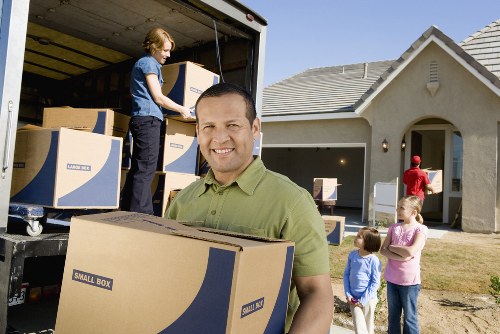 Furniture and boxes being transported by a local moving service
